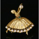 An Italian gold emerald, diamond and cultured pearl dancer brooch, c.1950,