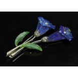 A Continental white gold lapis lazuli, nephrite and diamond flower brooch,