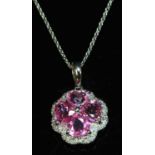 An 18ct white gold pink sapphire and diamond cluster pendant,