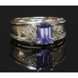 A Continental tanzanite and diamond band ring,