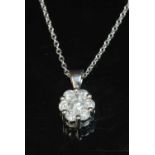 A 9ct white gold diamond set cluster pendant,