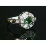 An 18ct white gold tsavorite garnet and diamond cluster ring,