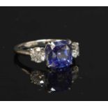 A platinum three stone sapphire and diamond ring,