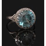 A white gold blue zircon and diamond cluster ring,