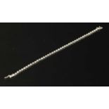 An 18ct white gold diamond set line bracelet,