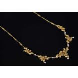 A French Belle Époque gold and pearl, rose bloom necklace,