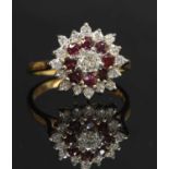 An 18ct gold diamond and ruby three-tier cluster ring,