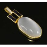 A gold moonstone, sapphire and diamond pendant,