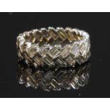 A white gold diamond set band ring,