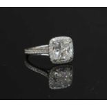 A platinum diamond halo cluster ring,