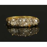 A Victorian five stone diamond carved head ring,