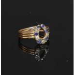 A sapphire and diamond horseshoe ring,