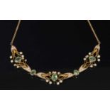 An Edwardian gold peridot and split pearl necklace,