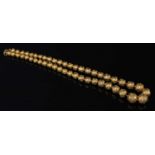 A Victorian Etruscan Revival graduated gold bead necklace, c.1860,