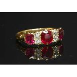 An 18ct gold synthetic ruby and diamond carved head ring,