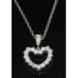 An 18ct white gold diamond set heart pendant and chain,