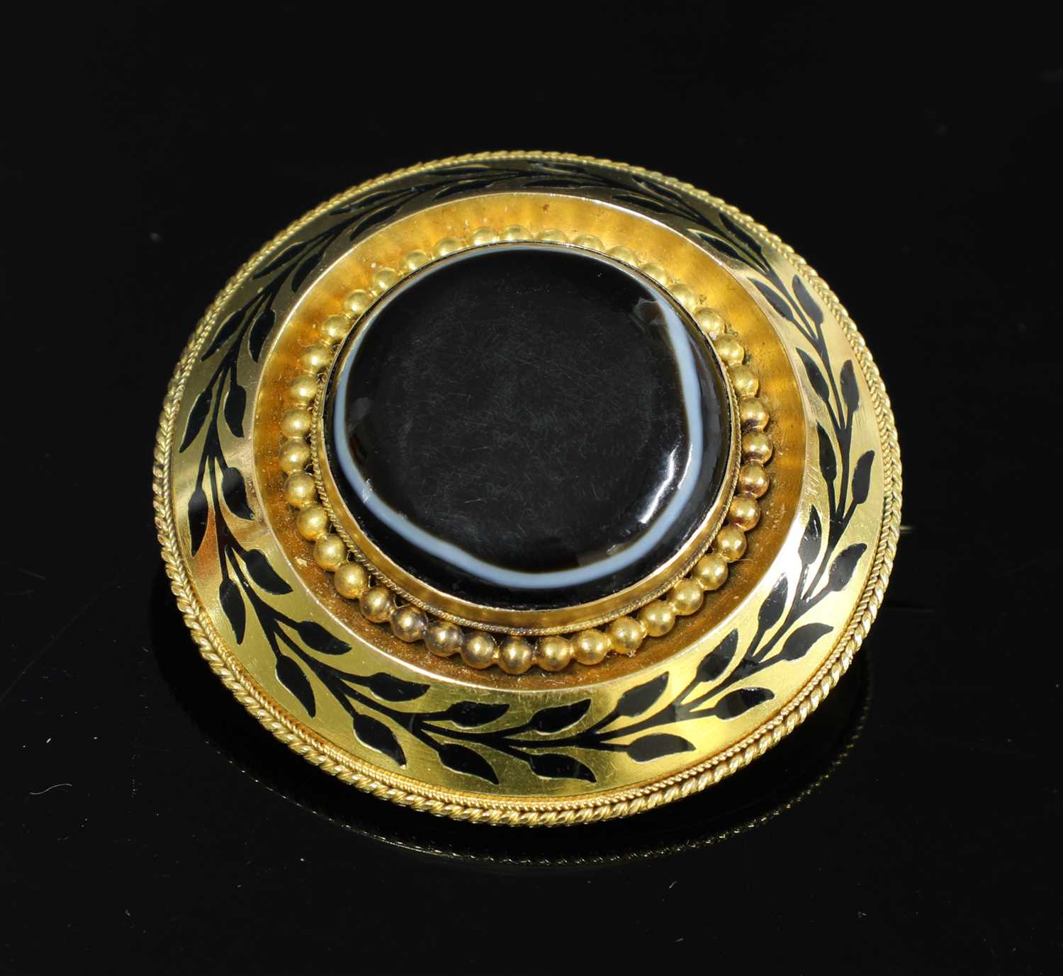 A Victorian gold, banded agate, circular shield form brooch,