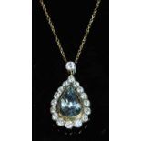 A yellow and white gold aquamarine and diamond pendant,
