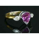 An 18ct yellow and white gold three stone pink sapphire and diamond ring,
