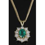An 18ct gold emerald and diamond cluster pendant,