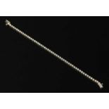 An 18ct white gold diamond set line bracelet,