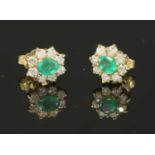 A pair of gold emerald and diamond cluster earrings,