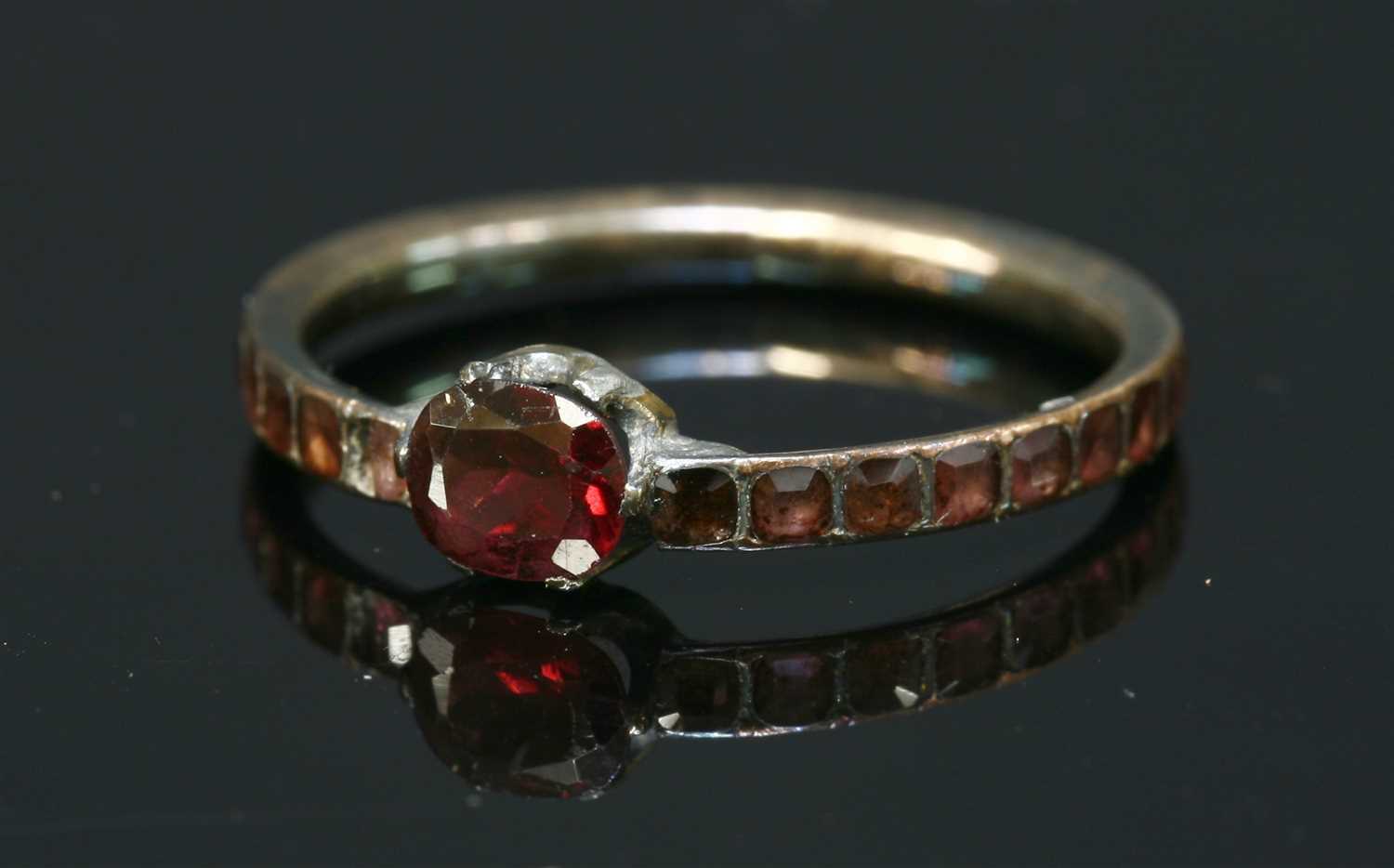 A Georgian gold flat cut garnet ring,