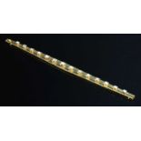 A Continental gold graduated diamond set line bracelet, c.1950,