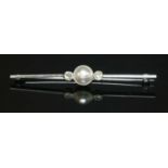 A white gold cultured pearl and diamond bar brooch,