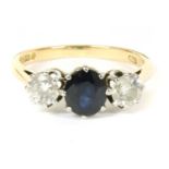 An 18ct gold three stone sapphire and diamond ring,