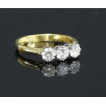 An 18ct gold three stone diamond ring,