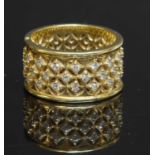 A gold diamond set flat section band ring,