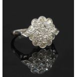 An Art Deco-style diamond three row daisy cluster ring,