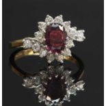 An 18ct gold ruby and diamond crossover cluster ring,