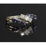 An 18ct white gold three row diamond and sapphire band ring,
