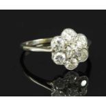 An Art Deco diamond set daisy cluster ring,