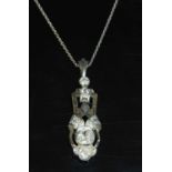 A Continental Art Deco diamond set pendant,