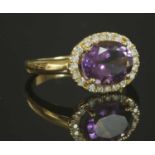 An Italian rose gold amethyst and diamond halo cluster ring,