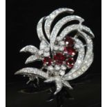 A white gold ruby and diamond set spray brooch,