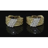 A pair of yellow and white gold diamond set earrings,
