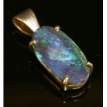 A silver single stone black opal pendant,