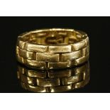 A gold two row brick link or panther chain effect band ring
