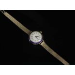 A ladies' French gold and enamel early mechanical strap watch,