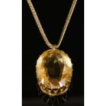A single stone gold citrine pendant,