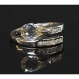 A 14ct white gold rock crystal and diamond crossover ring,