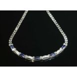 A white gold sapphire and diamond necklace