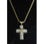 An Italian two colour yellow and white gold diamond set cross and chain,