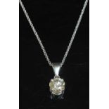 An 18ct white gold single stone diamond pendant,