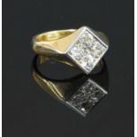 A 9ct gold four stone diamond offset square signet ring,