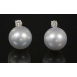 A pair of Continental white gold diamond and cultured South Sea pearl drop earrings,